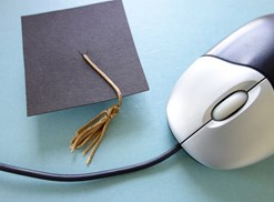 computer mouse and graduation cap