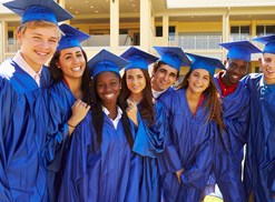 A group of high school graduates pose for a picture