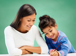 A special education teacher helps a student with homework