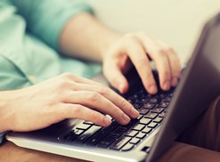 An aspiring ESL teacher works online to obtain their ESL certification online